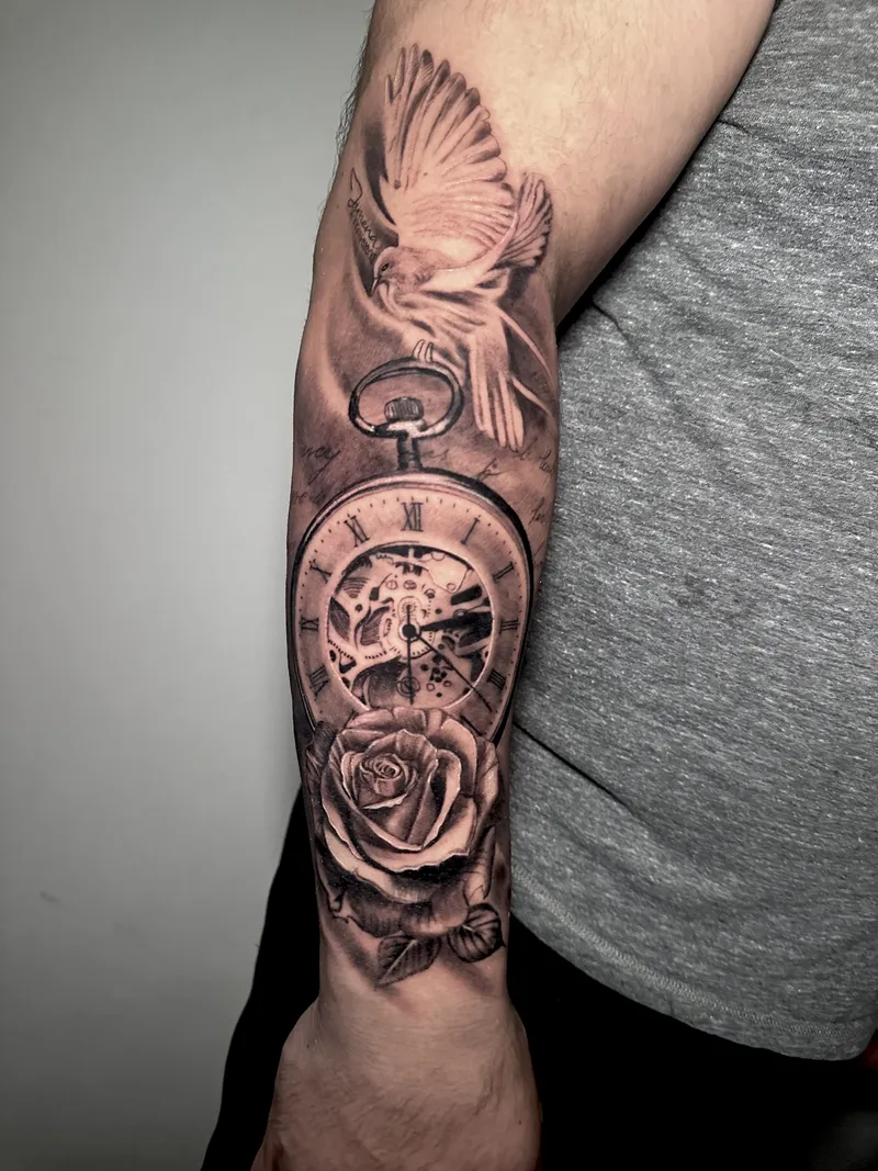 Black and grey pocket watch, dove and rose on the forearm