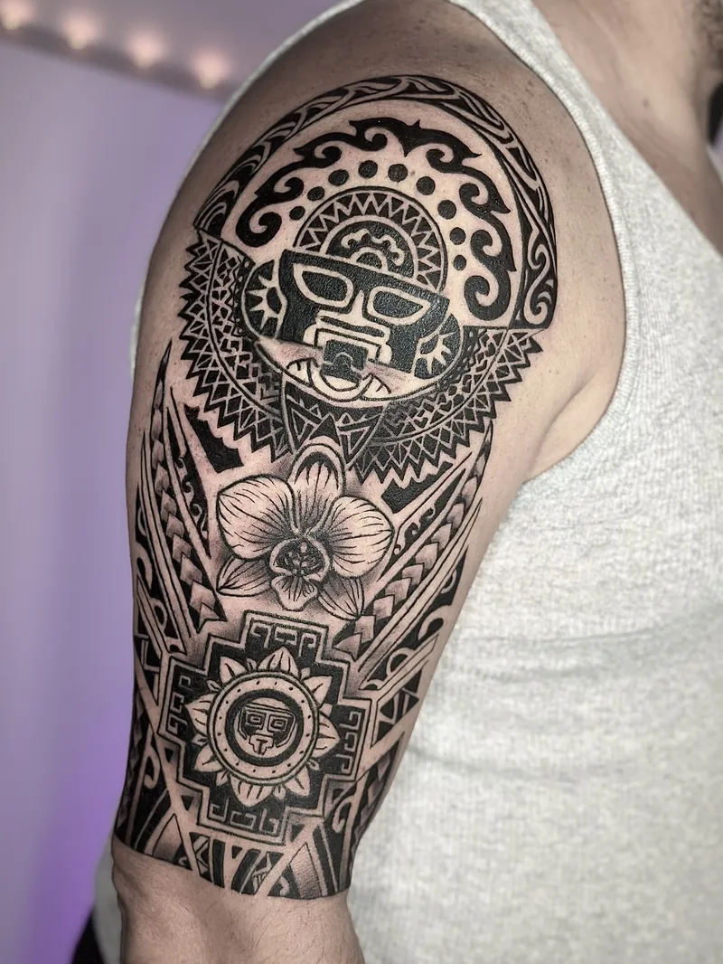 Polynesian blackwork half sleeve with a sun mask and geometric bands