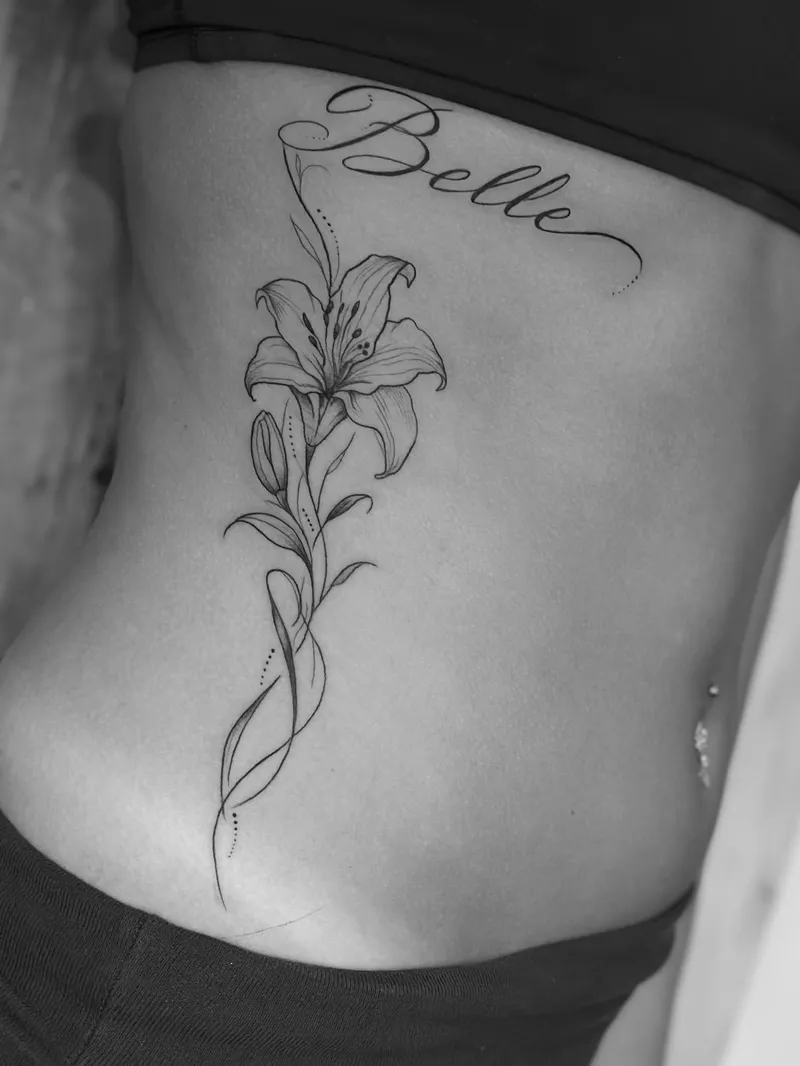 Fine line lily with script on the ribs