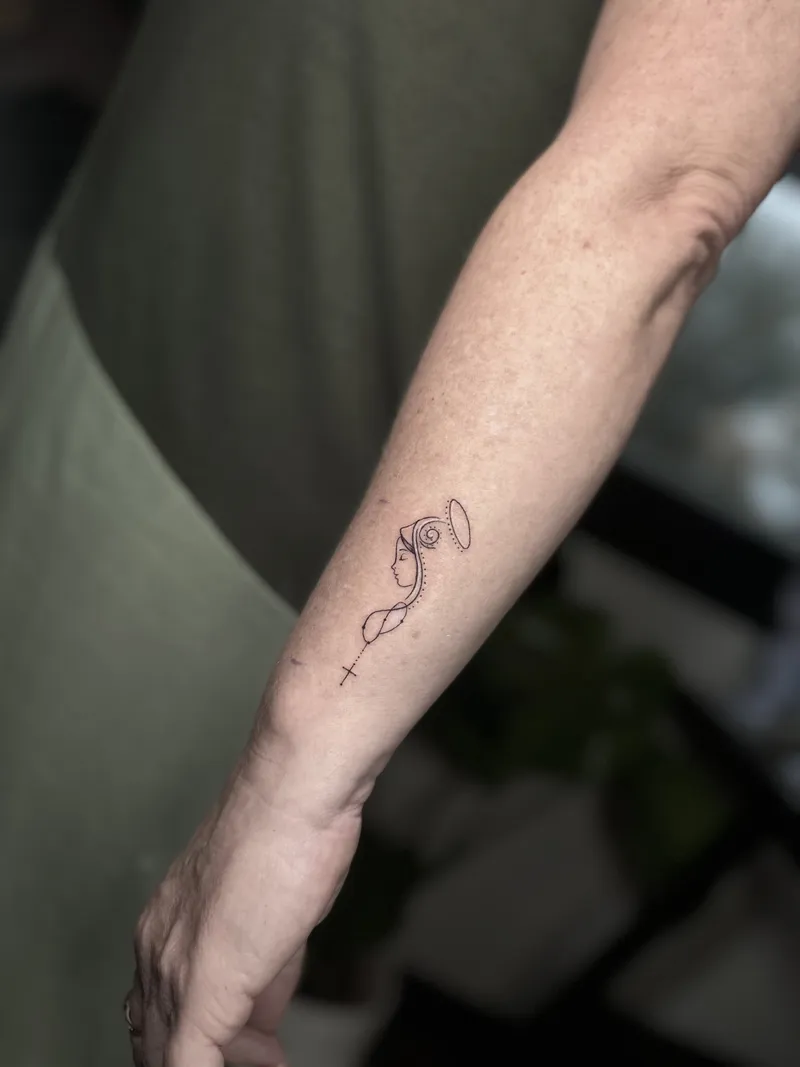 Small fine line symbol on the inner forearm