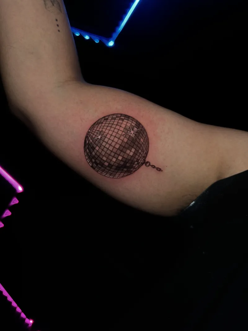 Dotwork disco ball rendered entirely in stippling on the inner arm